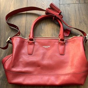 Silver wine colored hand held or tote bag by Coach